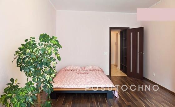 A cozy two-bedroom apartment in a new house is located in th