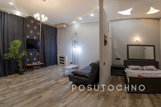 You can rent an apartment in the center of Kiev on Proreznay