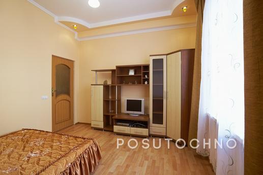 This apartment is located in a tiny Lviv street facing Opera