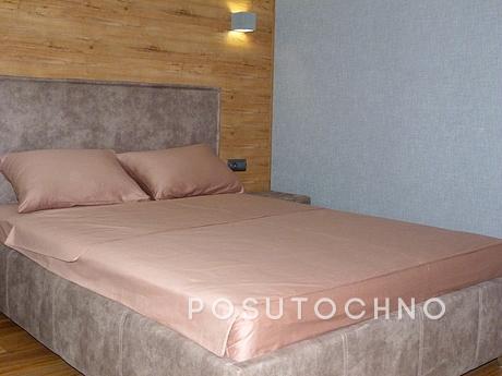 The apartment is in a modern style after repair. It is locat